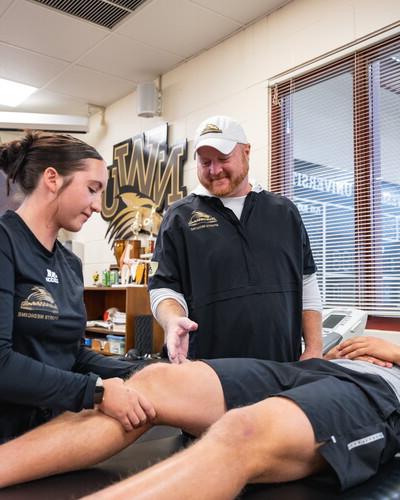 Jason Ensrud works with two NWU students.